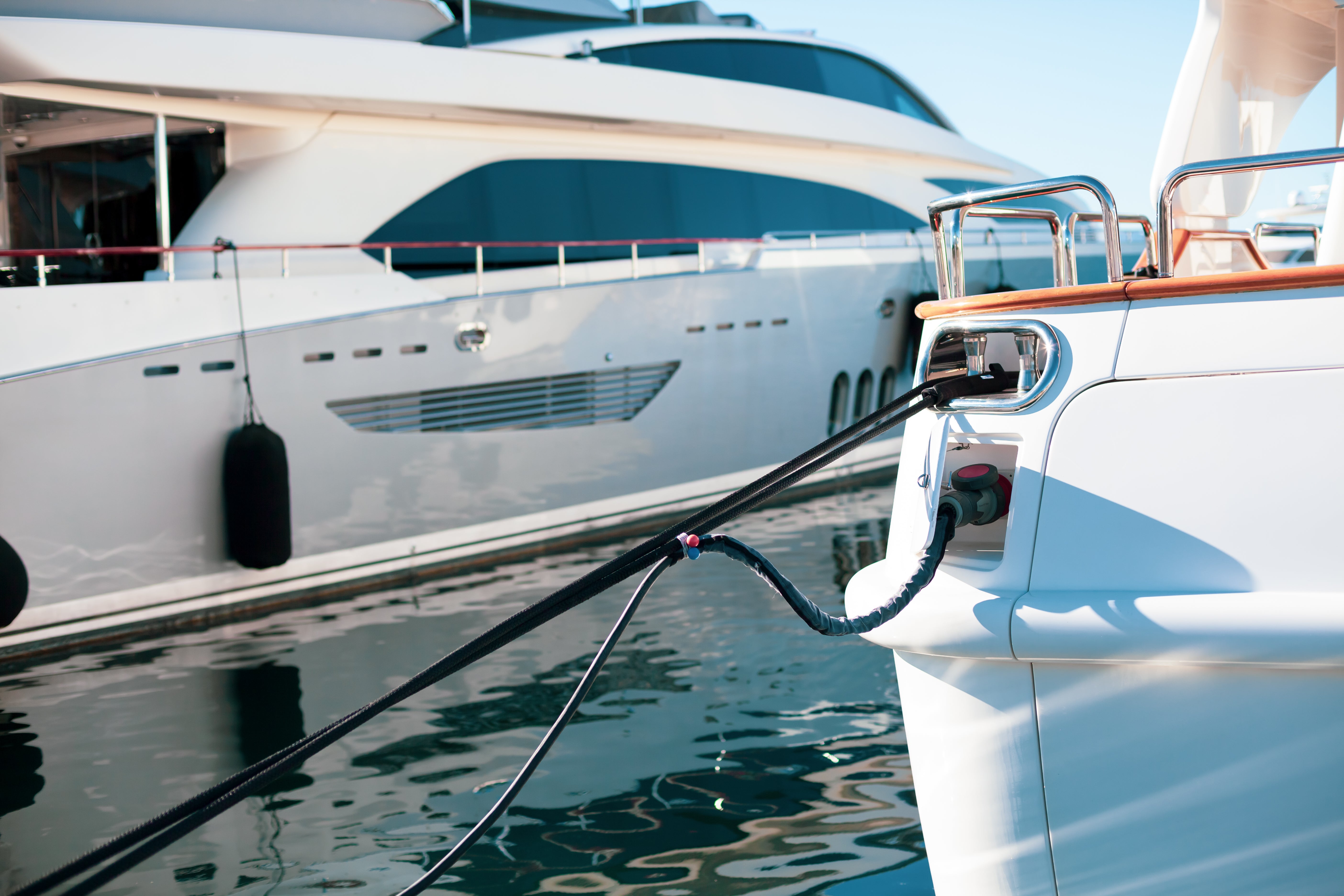 yacht docked with a power plug