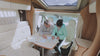 Couple reviewing a map sitting in a RV